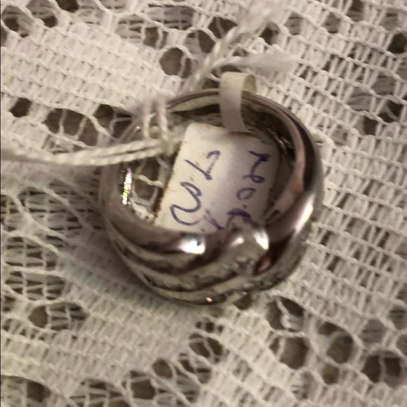 Ring Made of 9/5 Silver; and imitation diamond.